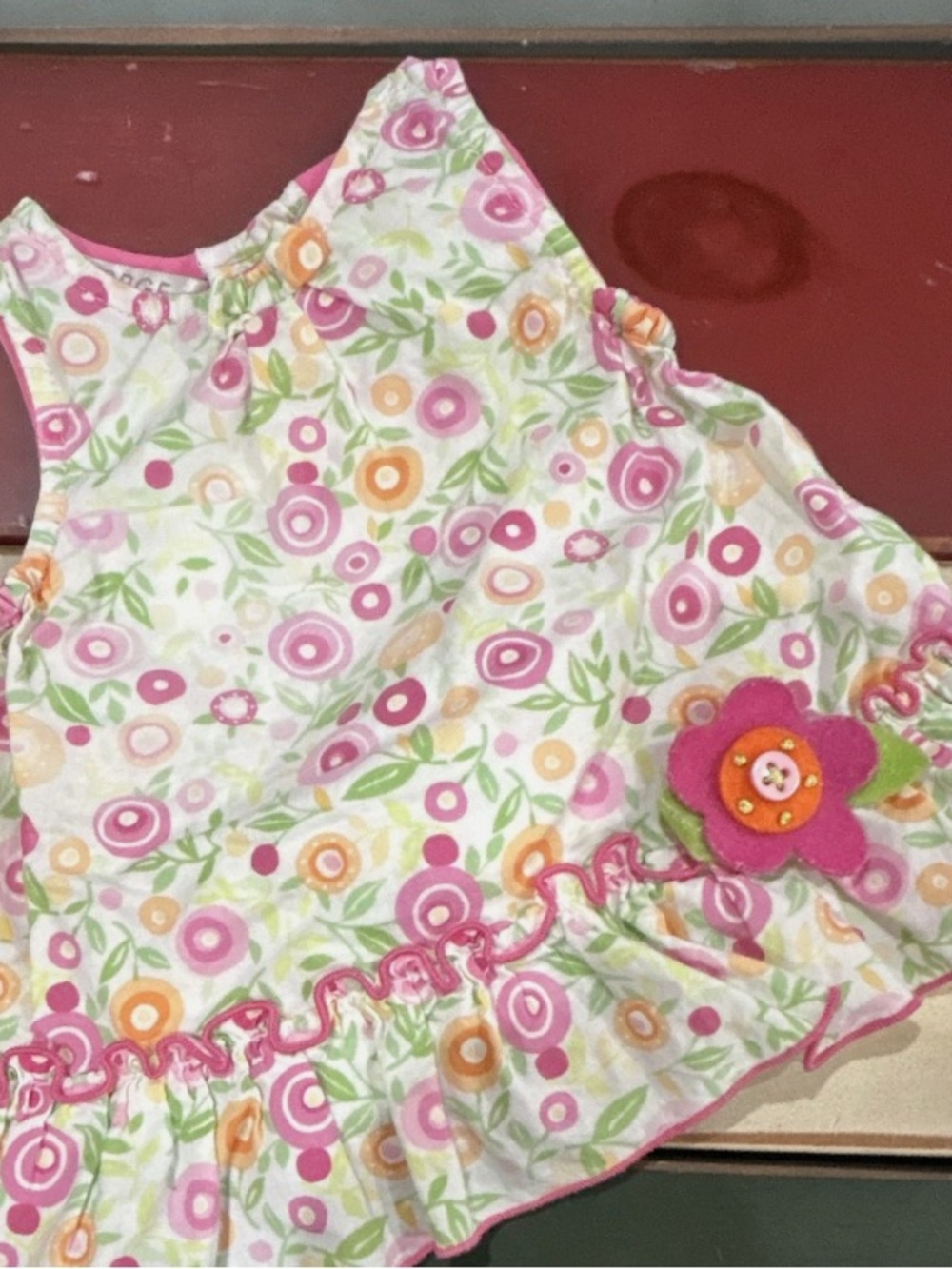 George Floral Bib in Pink, Orange, Green and White with Felt Flower